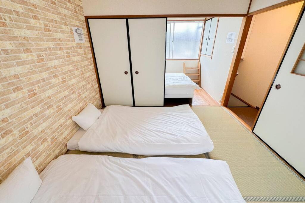 Apartment 【梅田・新大阪・usj近く】最寄駅jr西九条徒歩４分300ｍ！無料wi‐fi！２dk一軒家貸切！n